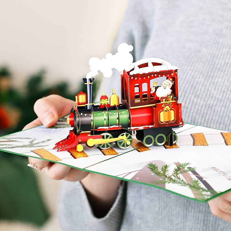 img src= "Christmas-train-pop-up-card-lifestyle_7a98854b-32eb-479d-ad9b-3e326e8d186c.jpg" alt="Christmas train pop up card"
